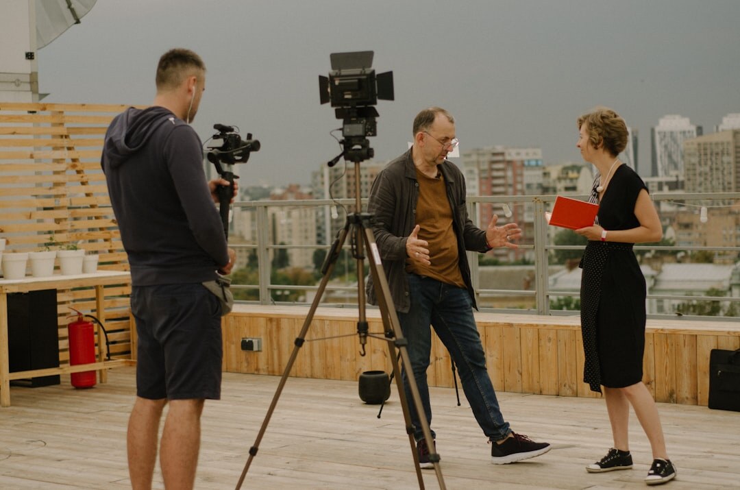 Breaking news coverage team filming on location in the city