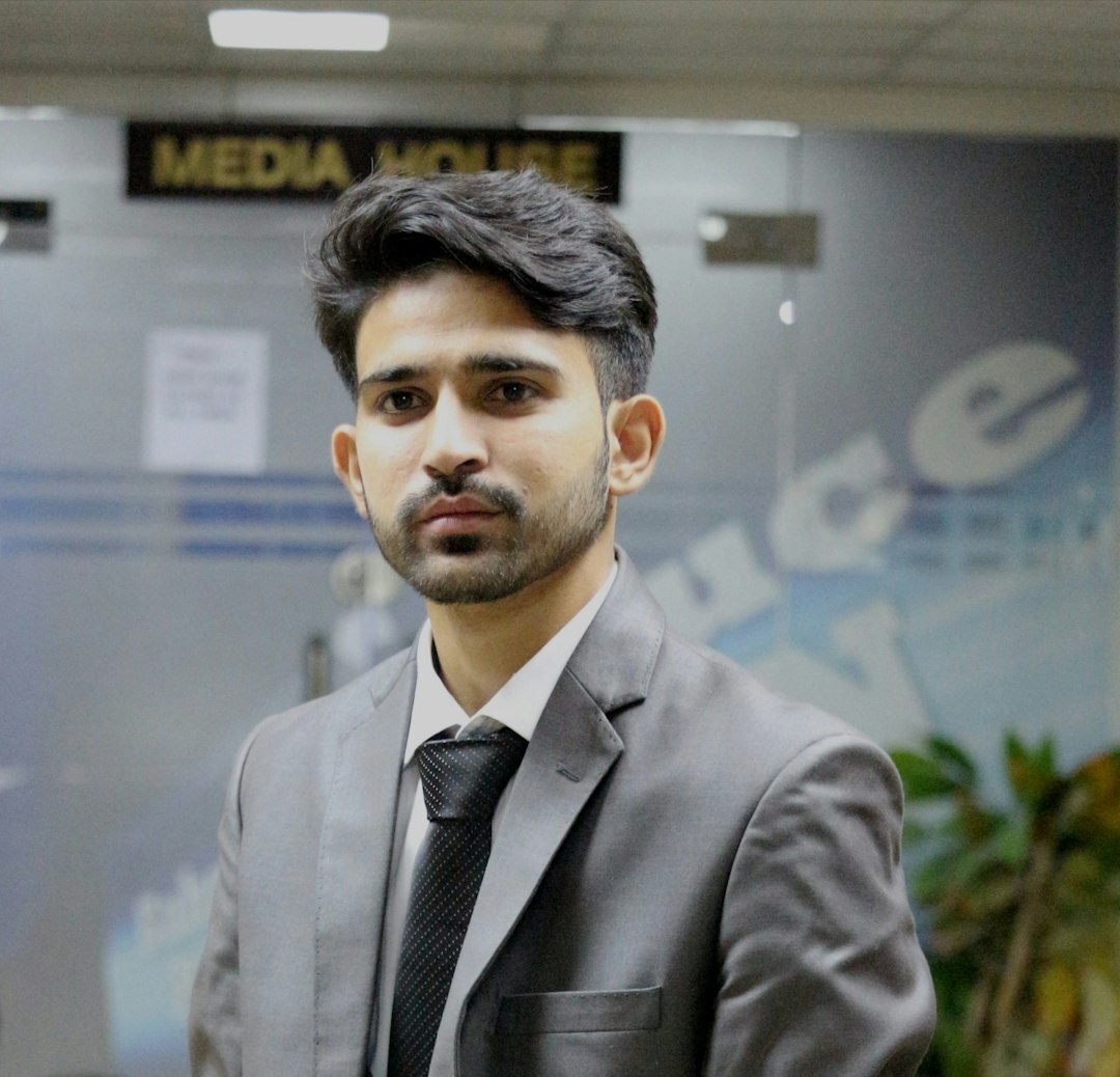 Professional news anchor presenting at a news desk with cameras