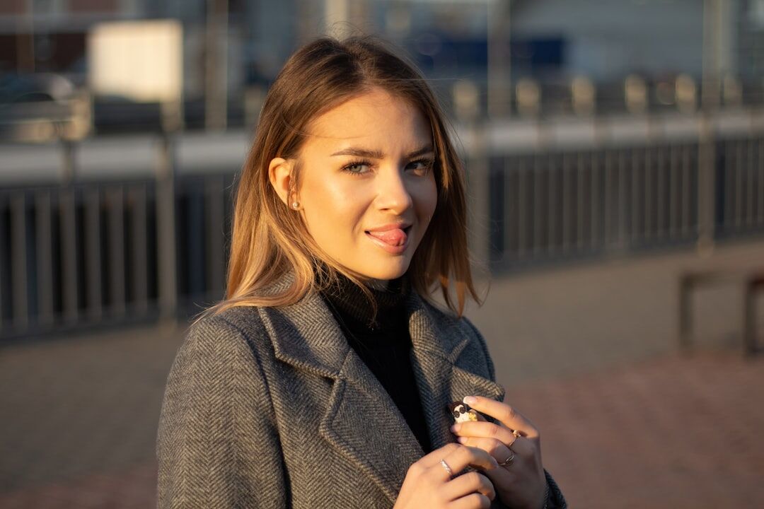 Professional female reporter doing a live broadcast outdoors holding a microphone