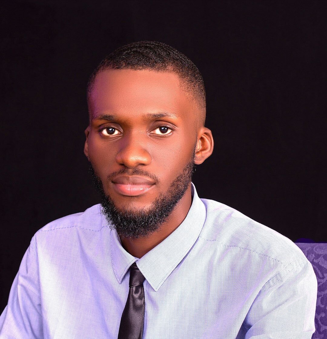 Professional headshot of a senior male journalist and media trainer