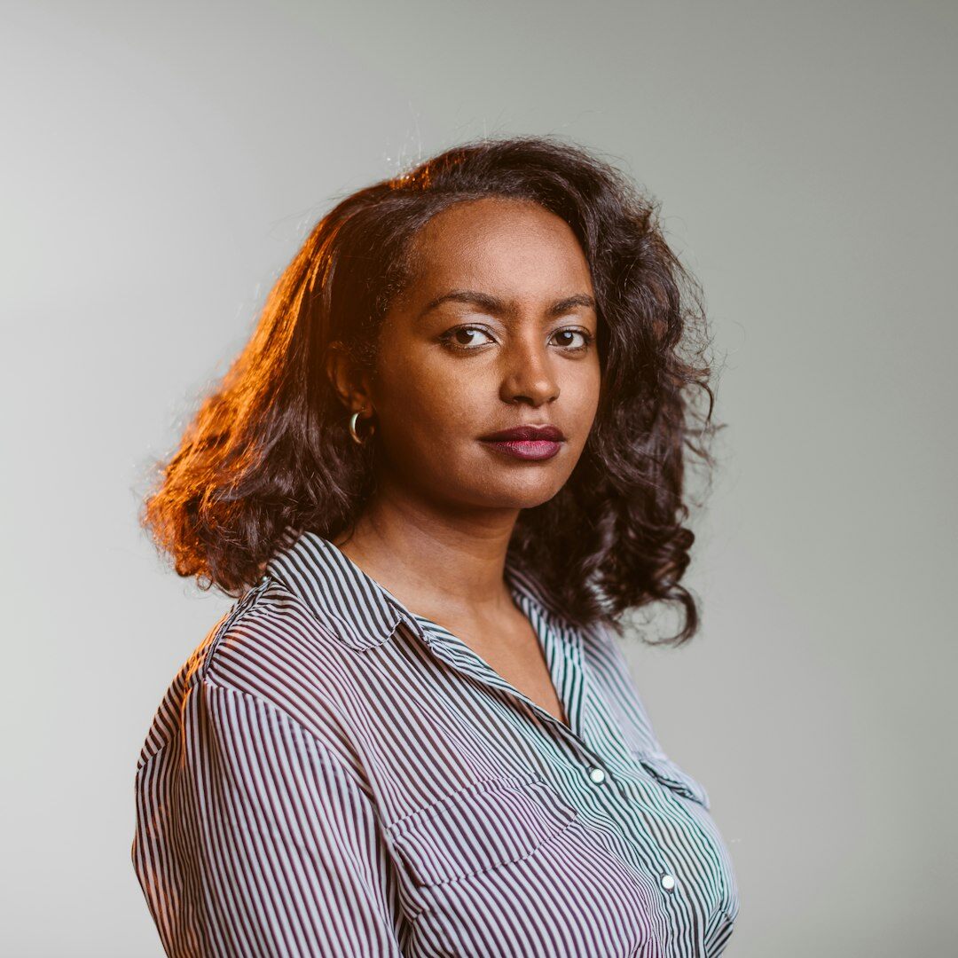 Professional headshot of a female camera operator and trainer