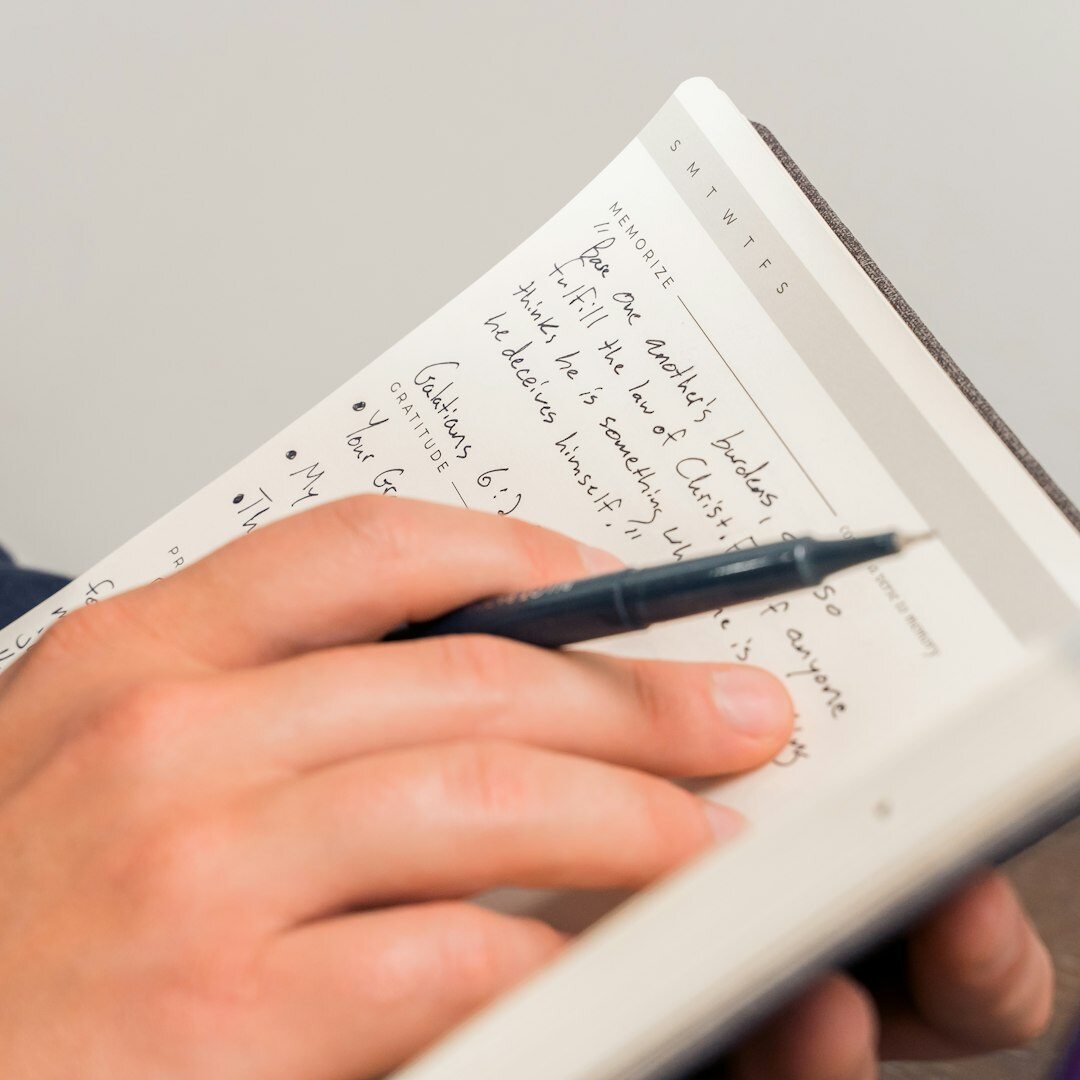 Young journalist student taking notes in a training classroom
